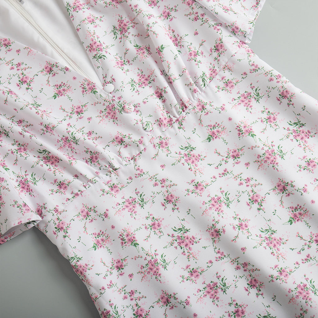 Floral Puff-Sleeve V-Neck Maxi Dress in White Floral — close-up of gathered waist seam