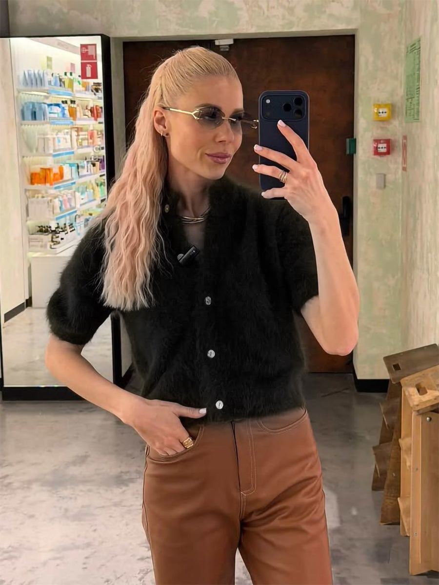 Fuzzy Knit Short Sleeve Cardigan with Mock Neck in Black — on model with brown pants