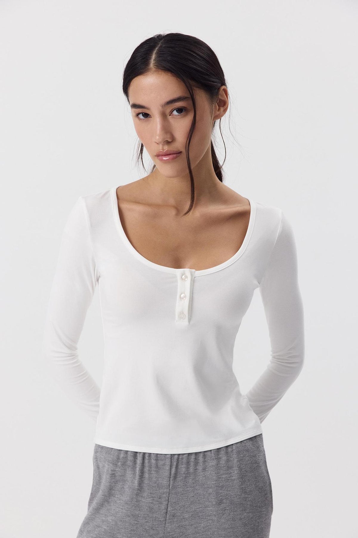 Modal Scoop Neck Button Long Sleeve Tee in White — front view on model