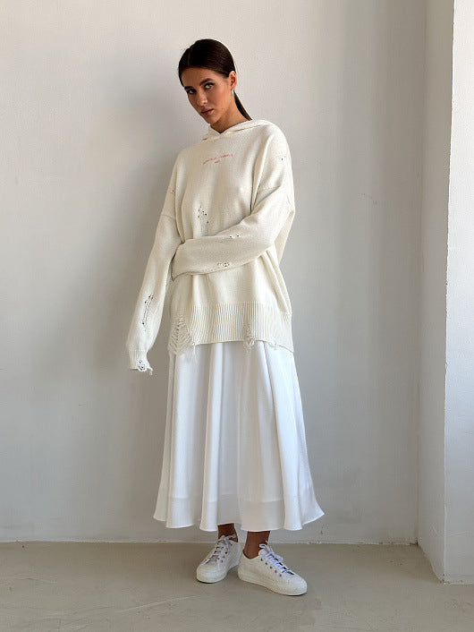 Satin A-Line Midi Skirt with Elastic Waist in Ivory White — front view on model with a cream sweater
