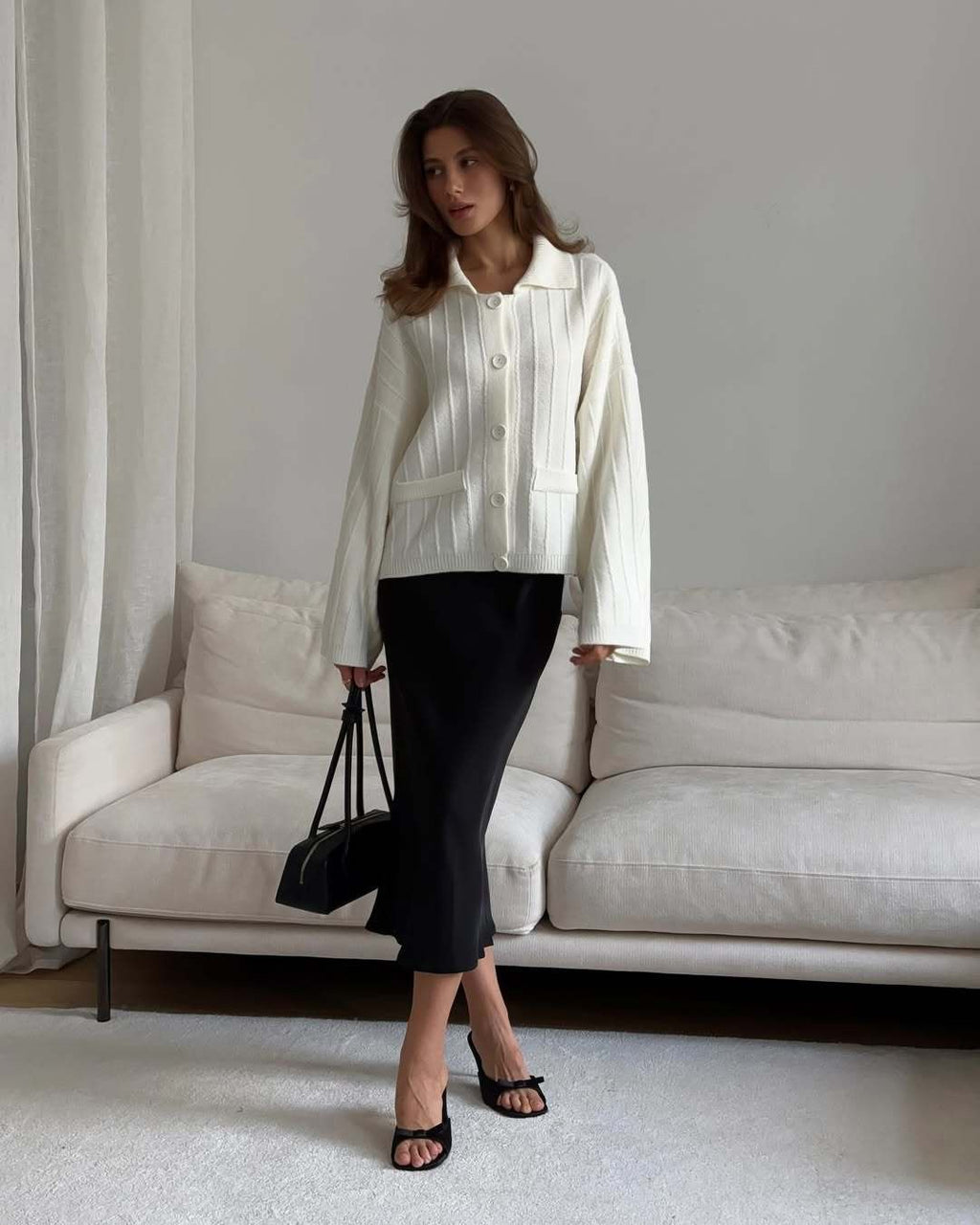 Oversized Collared Button Cardigan with Bell Sleeves in Ivory — full-length view on model with a midi skirt