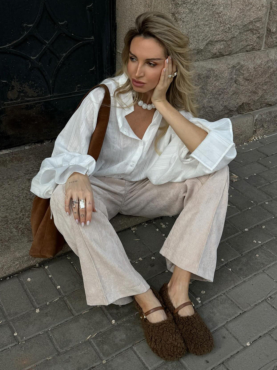 Cotton Corduroy Wide-Leg Pants with Pintuck Front in Cream — seated view on model