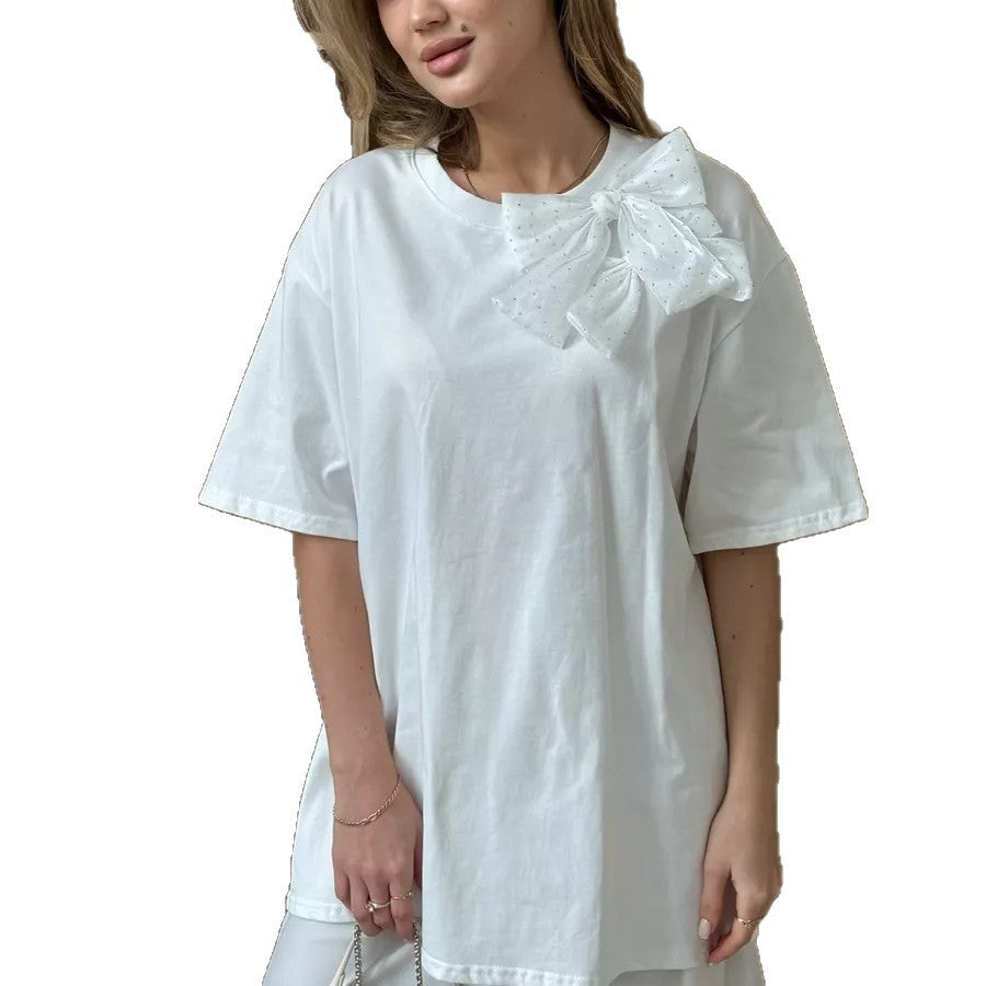 Oversized Cotton Tee with a Rhinestone Bow in White — front view on model