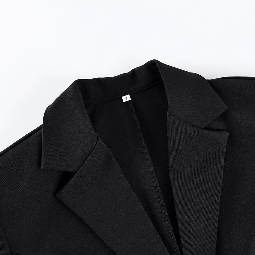 Fitted Blazer with Lace-Trimmed Hem and Cuffs in Black — close-up of the notch lapel