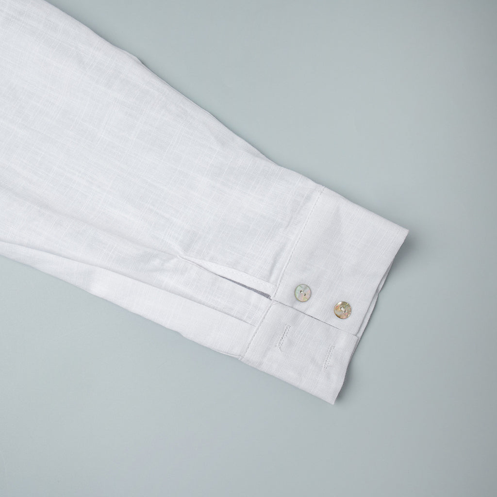 Relaxed Cotton Button-Down Shirt in White — close-up of the two-button cuff
