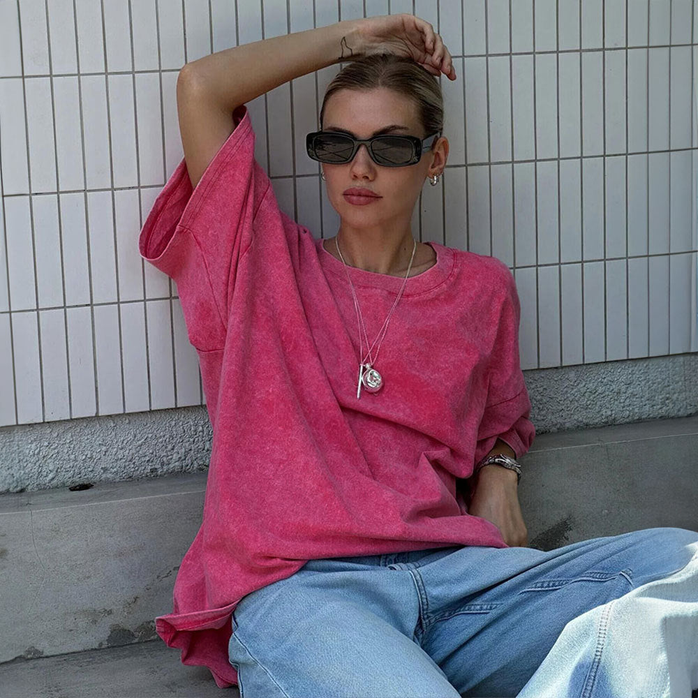 Oversized Washed Cotton Crewneck Tee in Hot Pink — front view on model, seated