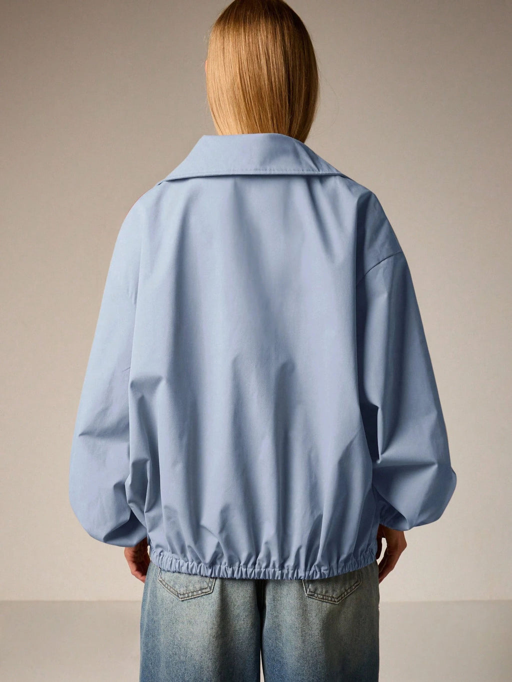 Oversized Half-Zip Funnel-Neck Windbreaker Jacket in Light Blue — back view on model