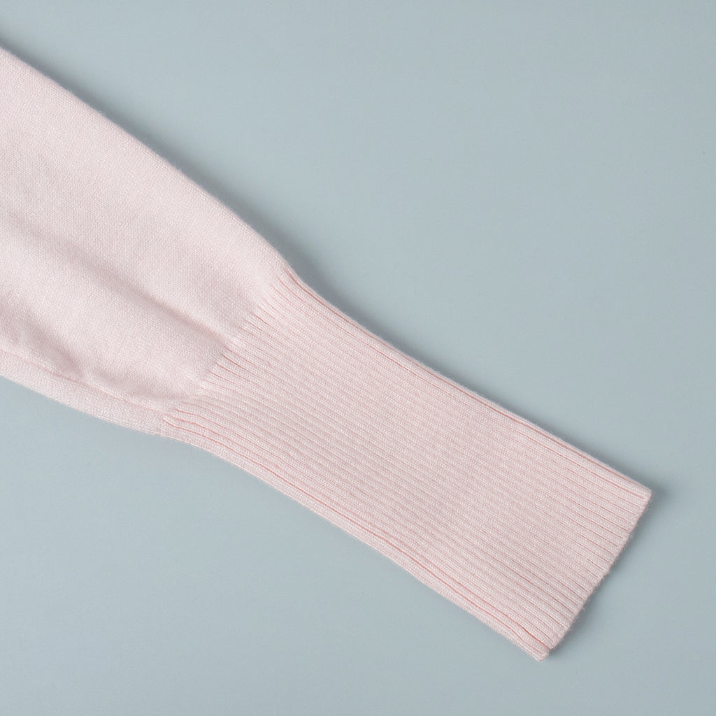 Fitted Cropped Ribbed Knit Cardigan in Blush Pink — close-up of slim sleeve and ribbed cuff