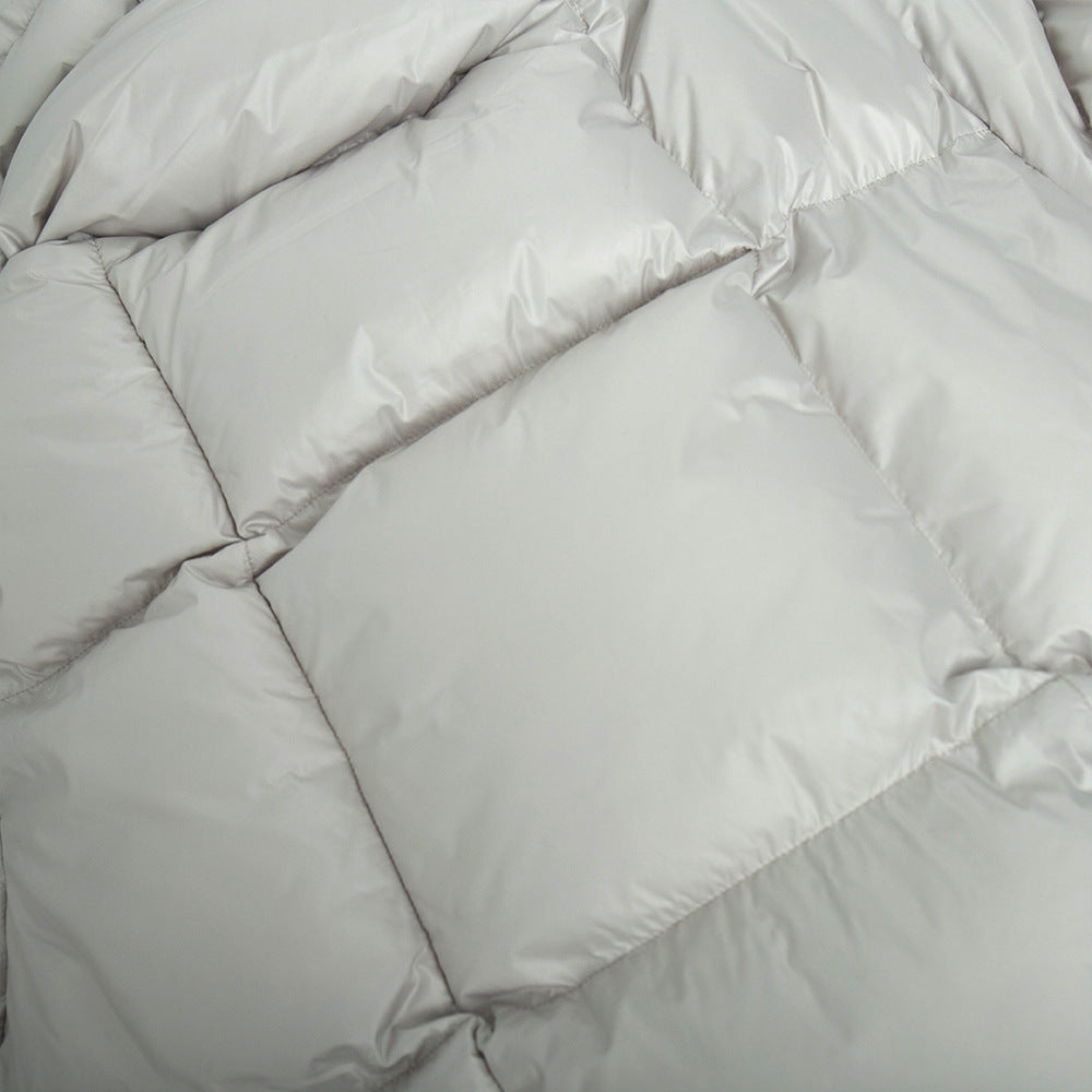 Cropped Hooded Puffer Jacket with Drawstring Hem in Light Gray — close-up of the quilting