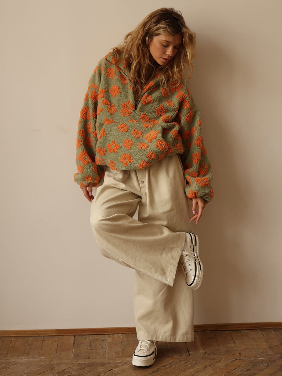 Floral Fleece Half-Zip Pullover Sweatshirt in Sage Orange Floral — full-length view with cream trousers
