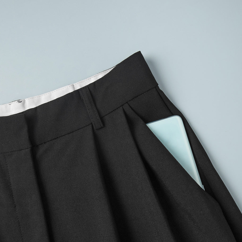 Pleated Wide-Leg Trousers in Black — close-up of side pocket