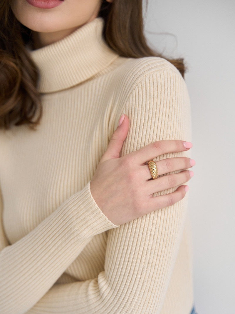 Fitted Ribbed Turtleneck Sweater in Cream — close-up of turtleneck collar and rib knit