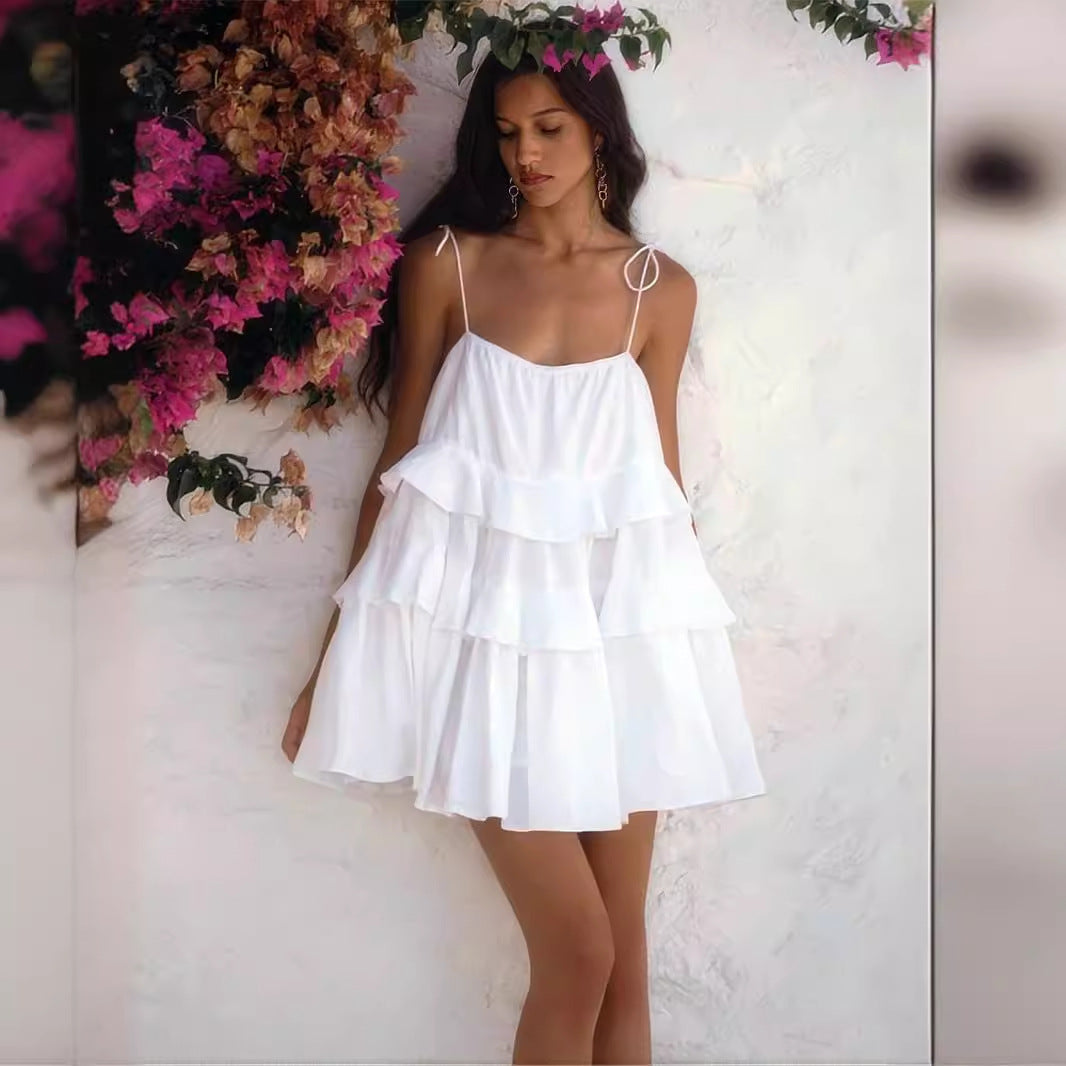 Tiered Ruffle Tie-Strap Mini Dress in White — front view on model