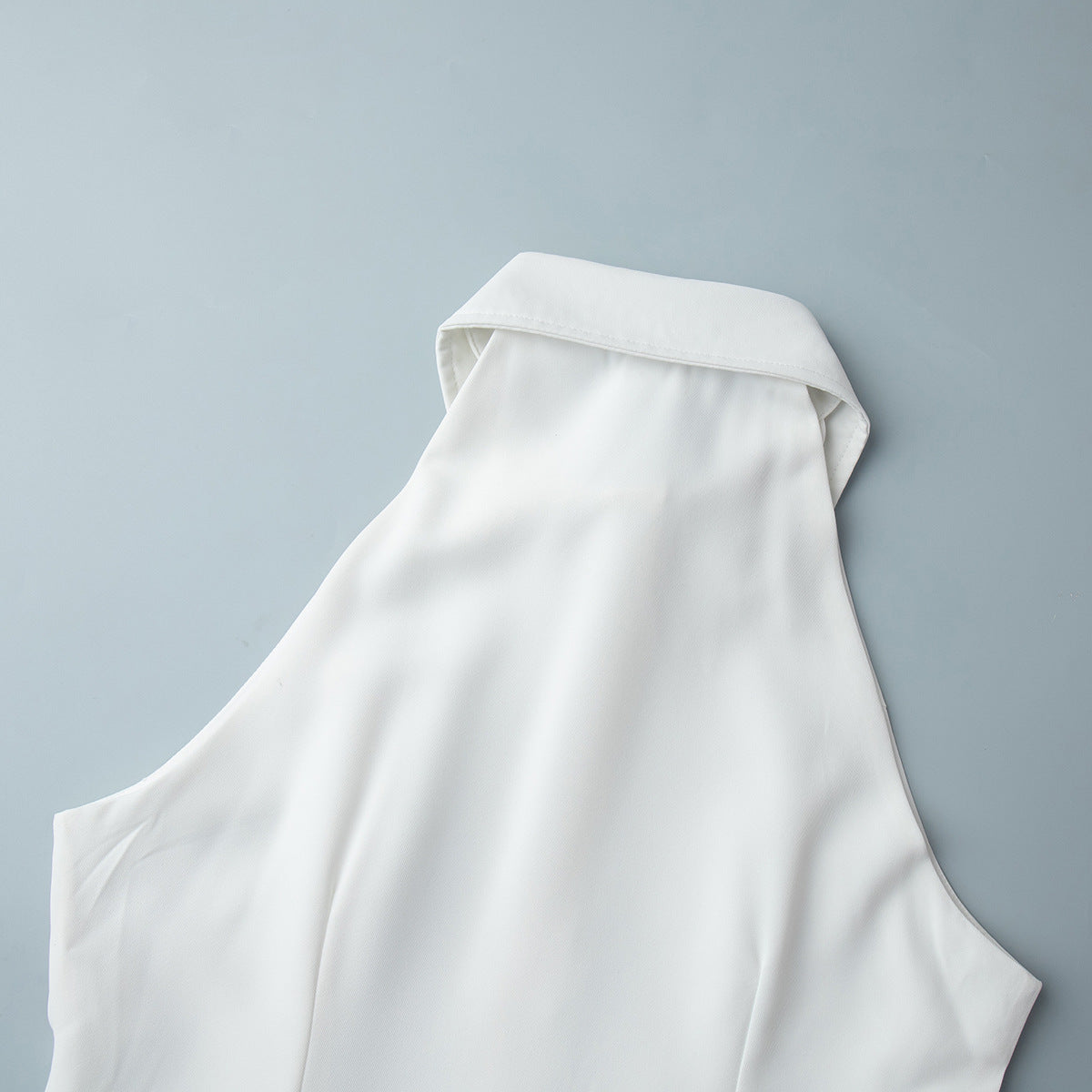 Sleeveless Button-Front Collared Maxi Dress in White — close-up of the armhole