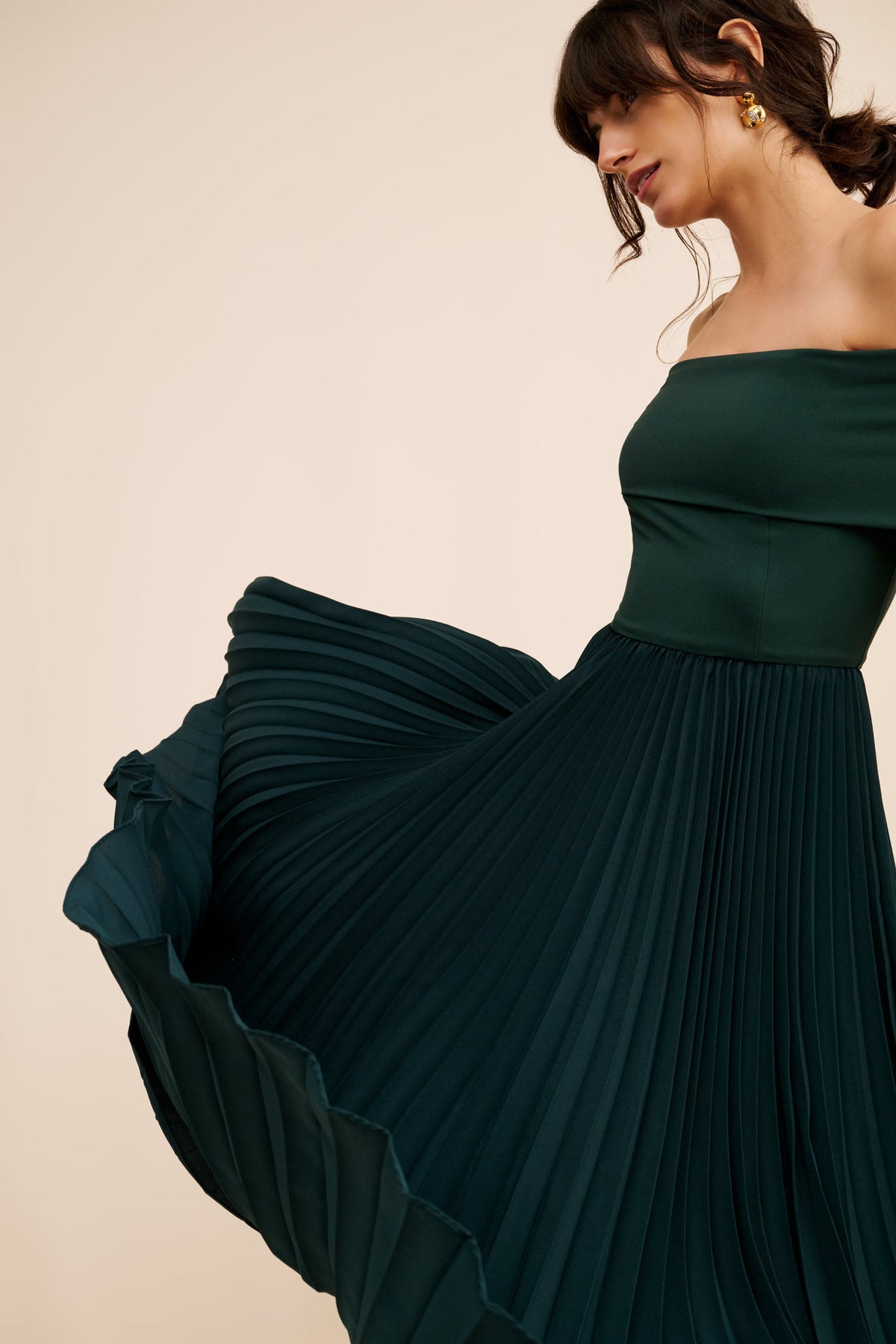 Off-the-Shoulder Long Sleeve Pleated Midi Dress in Dark Green — the pleated skirt in motion