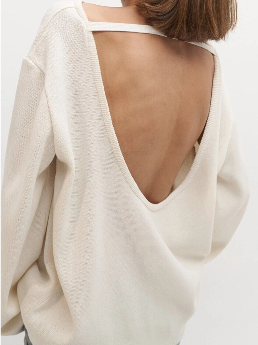 Oversized Open-Back Cotton Knit Sweater in Cream — open back view on model