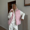 Stand Collar Puffer Vest with Pockets in Soft Pink — front view on model