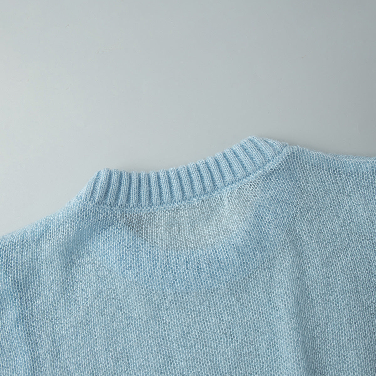 Soft Mohair-Blend Crew Neck Sweater in Light Blue — close-up of crew neck