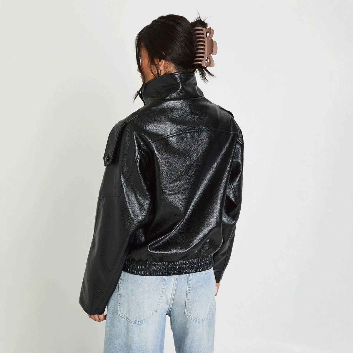 Oversized Stand-Collar Faux Leather Jacket in Black — back view on model