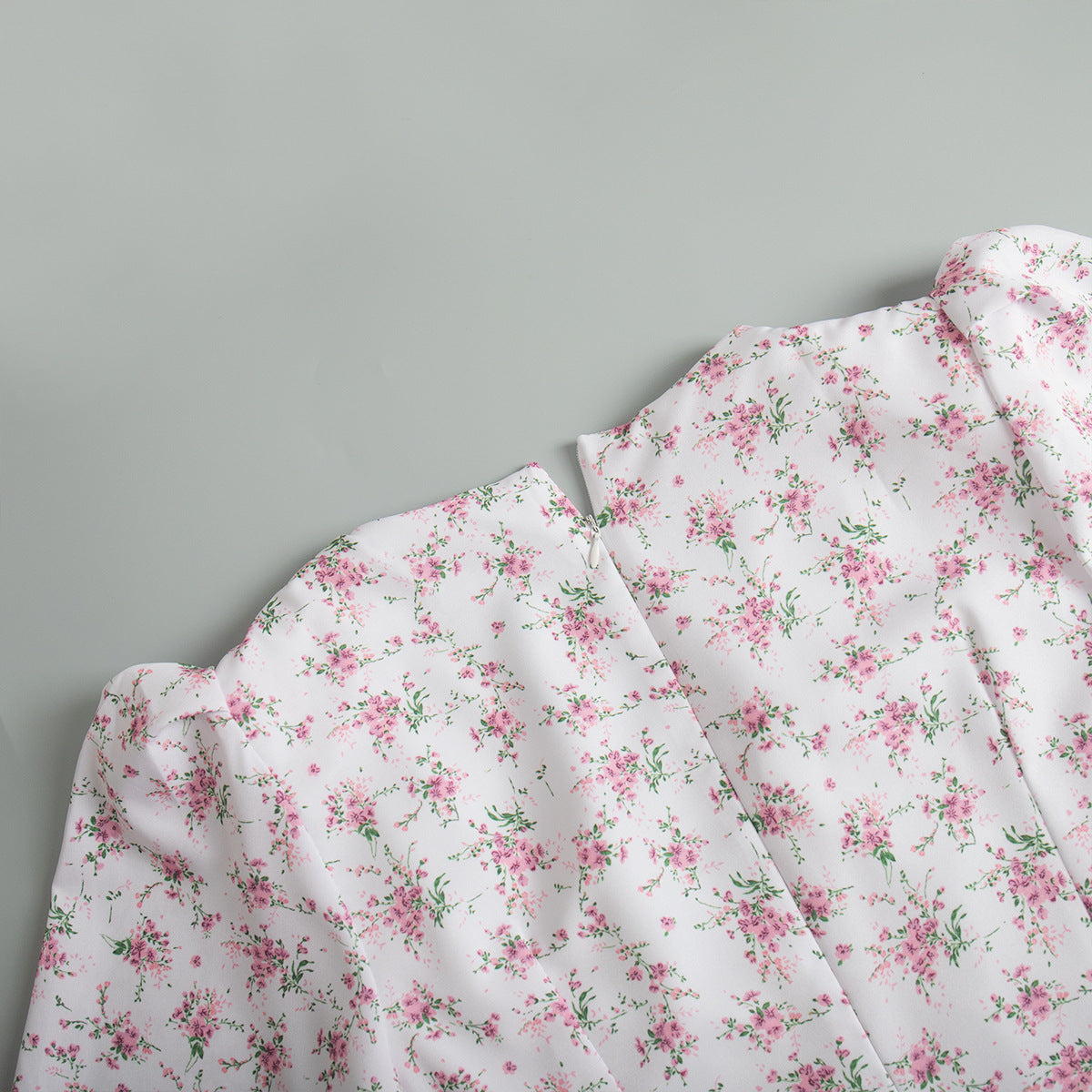 Floral Puff-Sleeve V-Neck Maxi Dress in White Floral — close-up of back neckline and concealed zip