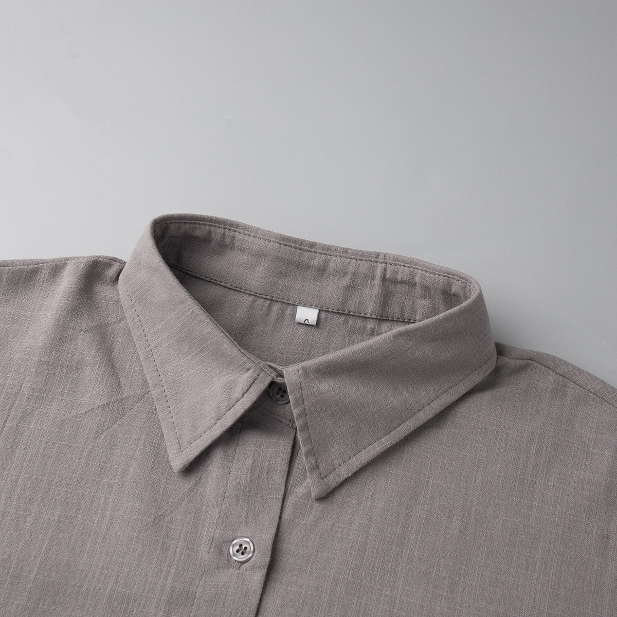 Oversized Cotton Shirt & Elastic-Waist Shorts Set in Taupe — close-up of the pointed collar