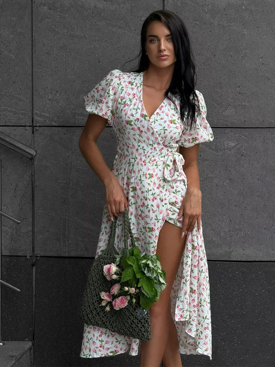 Cotton Puff-Sleeve Wrap Midi Dress in Pink Tulip — outdoor view with flower tote