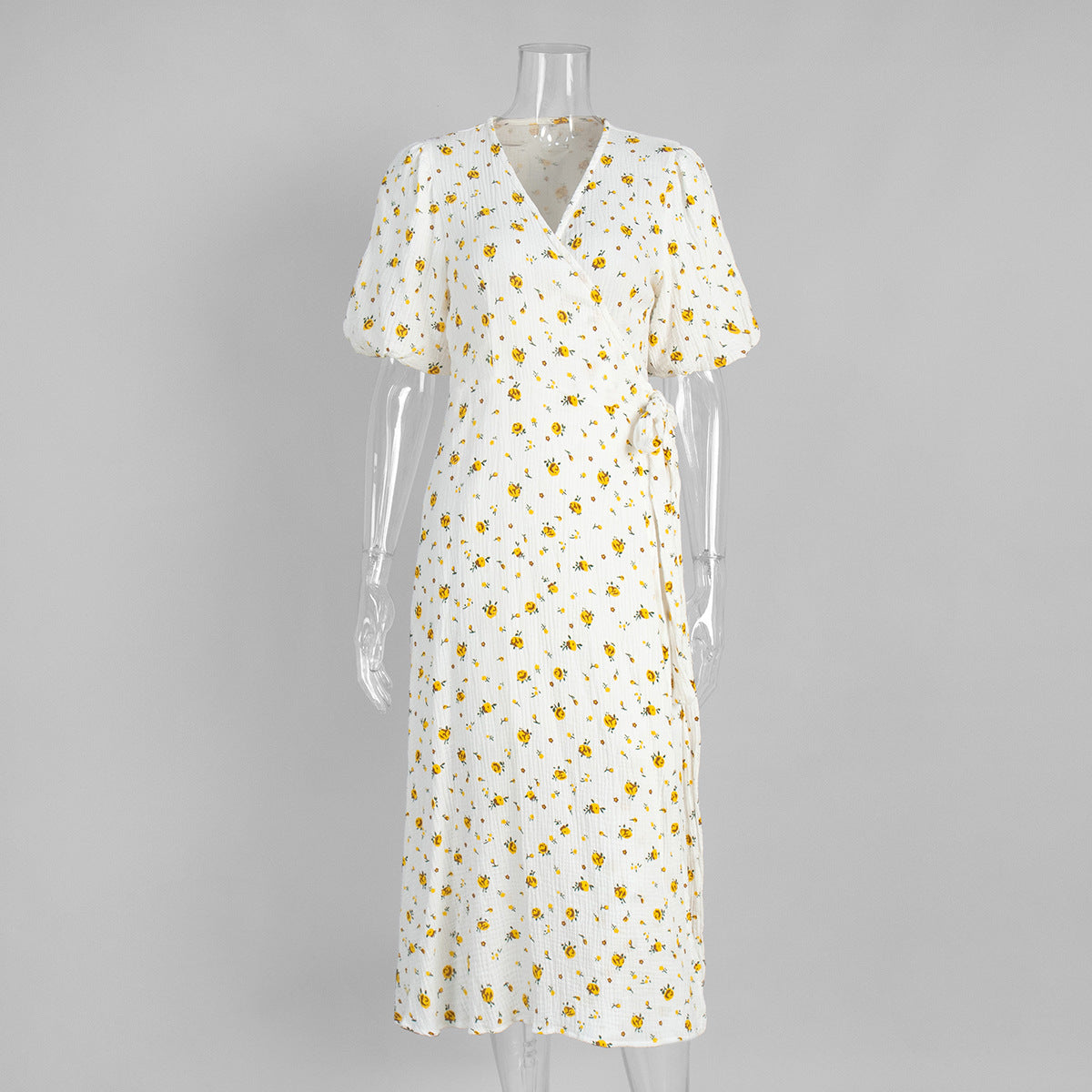 Cotton Floral Puff-Sleeve Wrap Midi Dress in Yellow Floral — front on mannequin