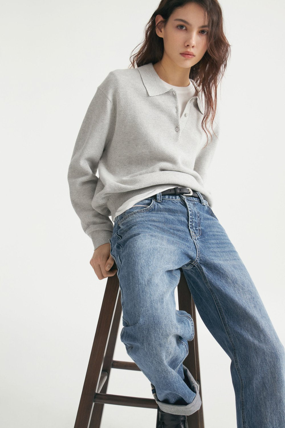 Relaxed Polo Collar Knit Sweater in Light Heather Gray — seated view on model