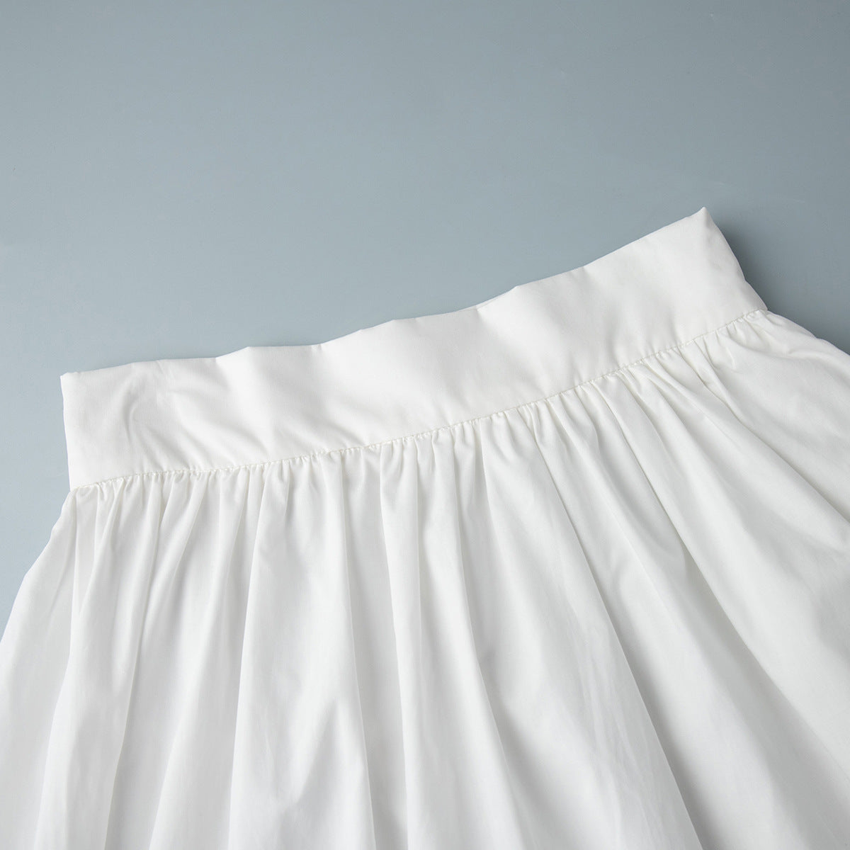 Cotton Crop Camisole & Gathered Maxi Skirt Set in White — close-up of the skirt waistband