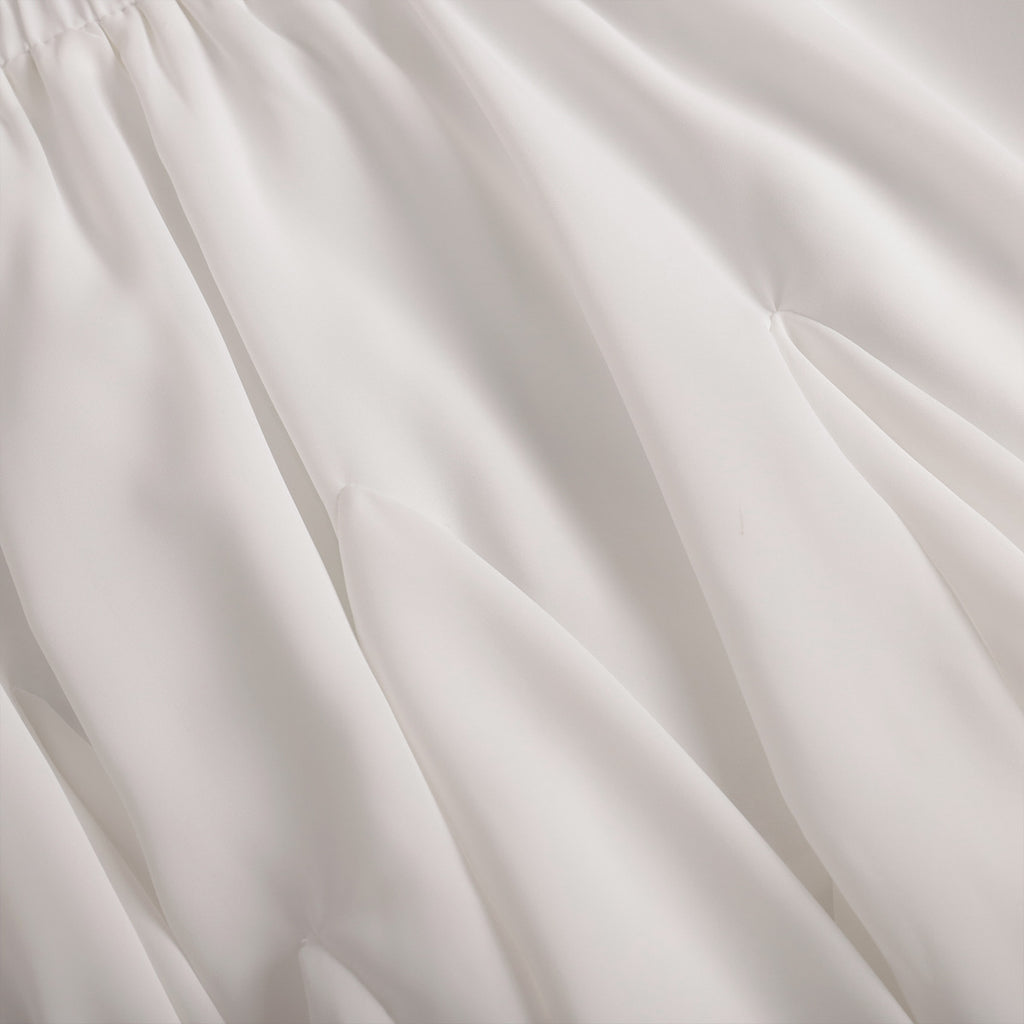 Pleated Bubble Mini Skirt in White — close-up of elastic waistband
