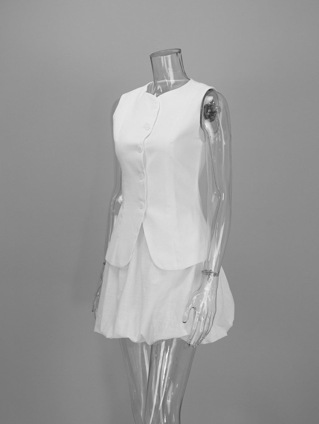 Cotton Peplum Vest & Bubble Mini Skirt Set in White — set on mannequin