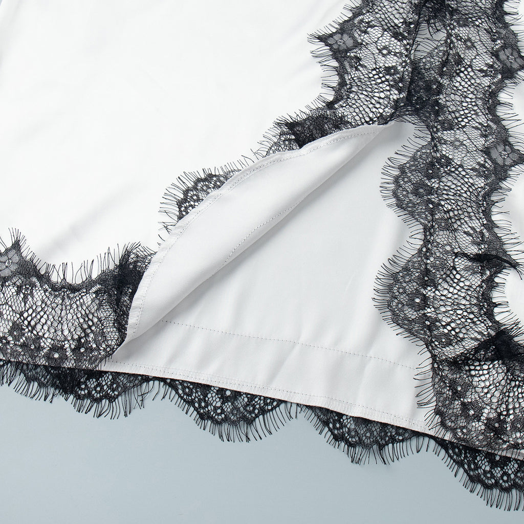 Lace-Trim Satin Maxi Slip Dress in White — close-up of the lace-trimmed side slit