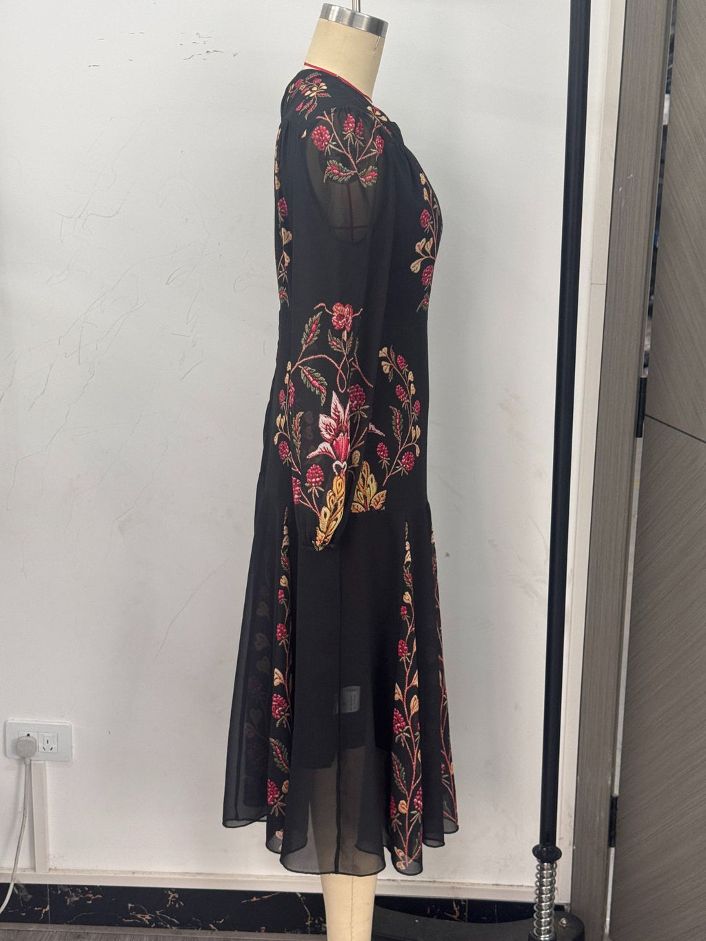 Floral Print Keyhole Midi Dress with Balloon Sleeves in Black — side view on a dress form
