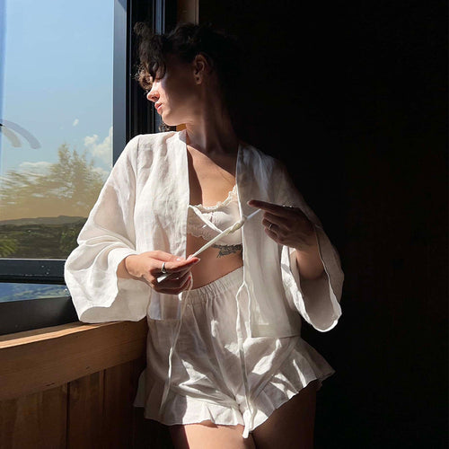 Cotton Tie-Front Top & Ruffle Shorts Set in White — indoor front view by a window
