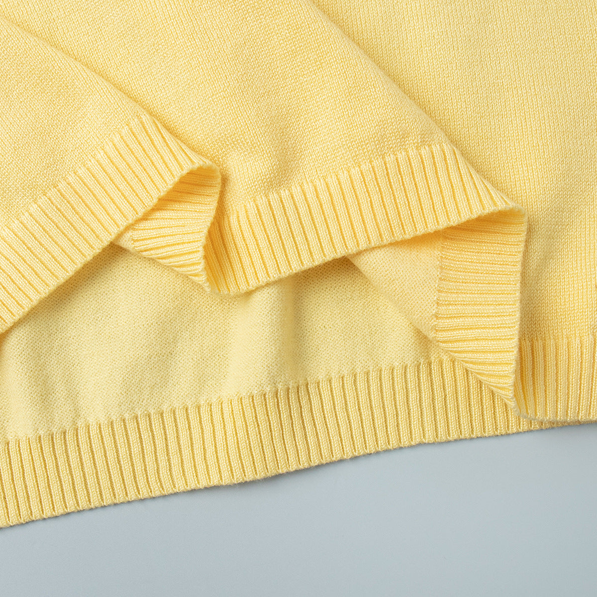 Short Sleeve Knit Top & Maxi Skirt Set in Butter Yellow — close-up of the ribbed hem