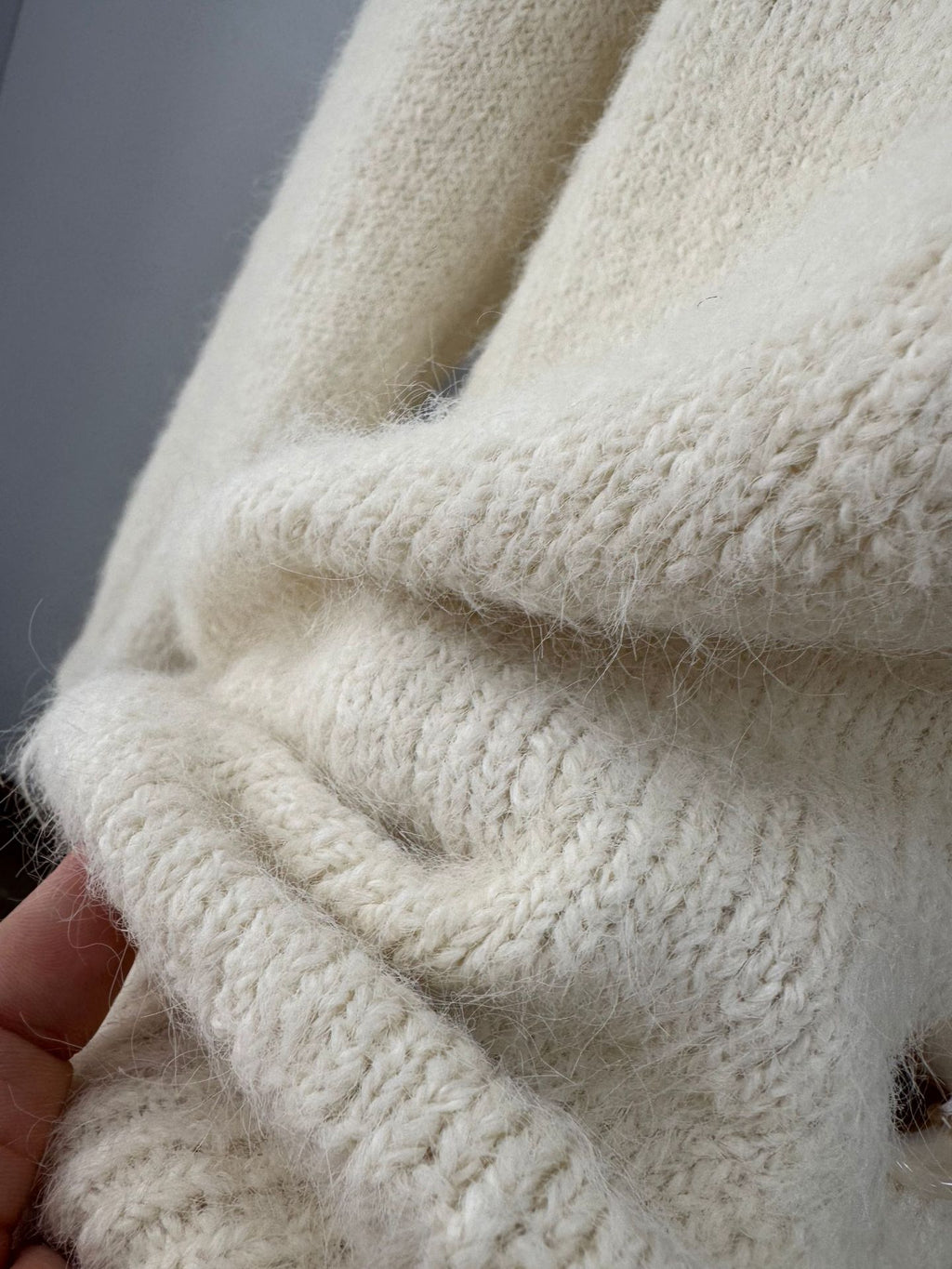 Fuzzy Wool-Blend V-Neck Button Cardigan in Ivory — close-up of the brushed knit texture