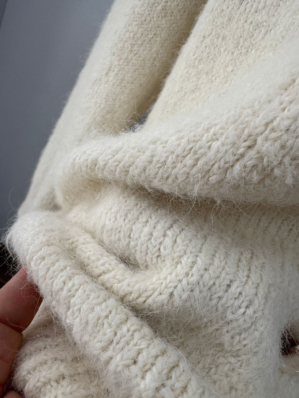 Fuzzy Wool-Blend V-Neck Button Cardigan in Ivory — close-up of the brushed knit texture