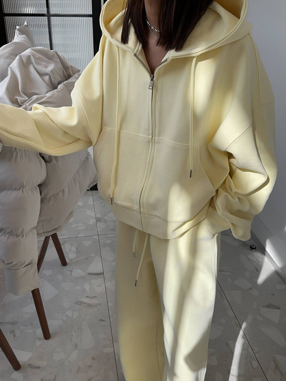 Oversized Zip-Up Hoodie & Wide-Leg Sweatpants Set in Butter Yellow — close view on model