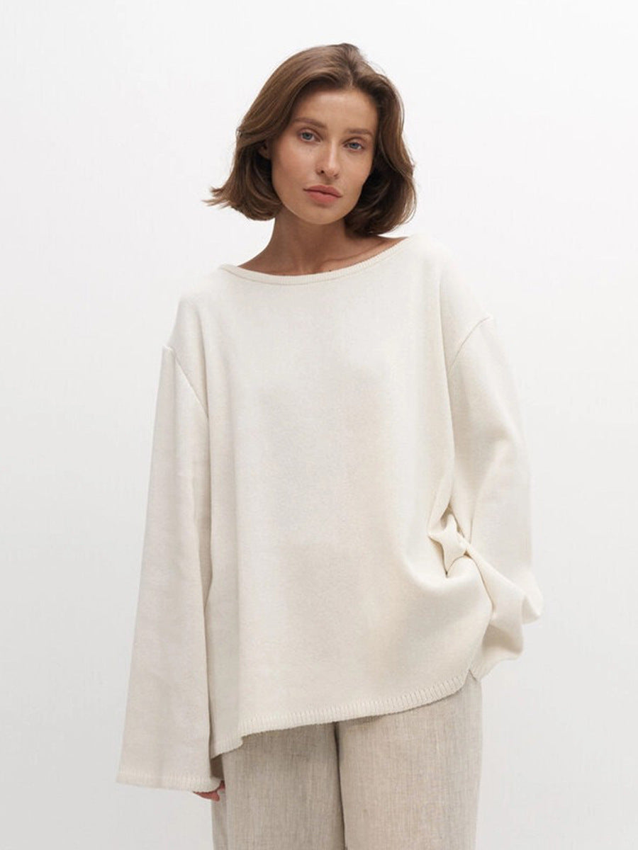 Oversized Open-Back Cotton Knit Sweater in Cream — front view on model