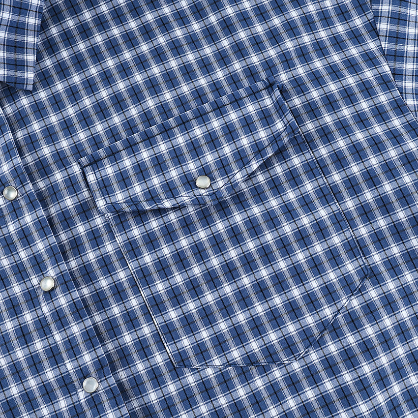 Oversized Cotton Plaid Button-Up Shirt in Navy Plaid — close-up of the chest pocket