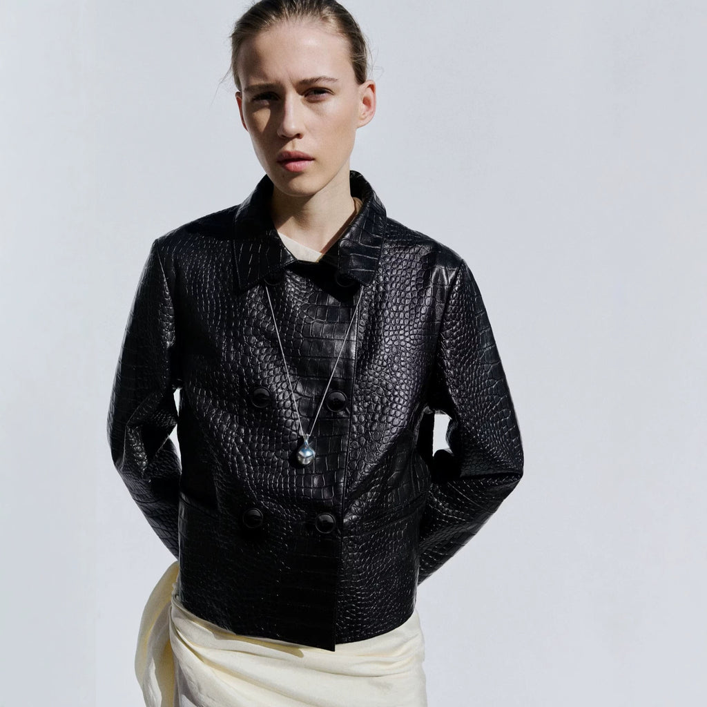 Cropped Double-Breasted Faux Leather Jacket in Black — front view on model