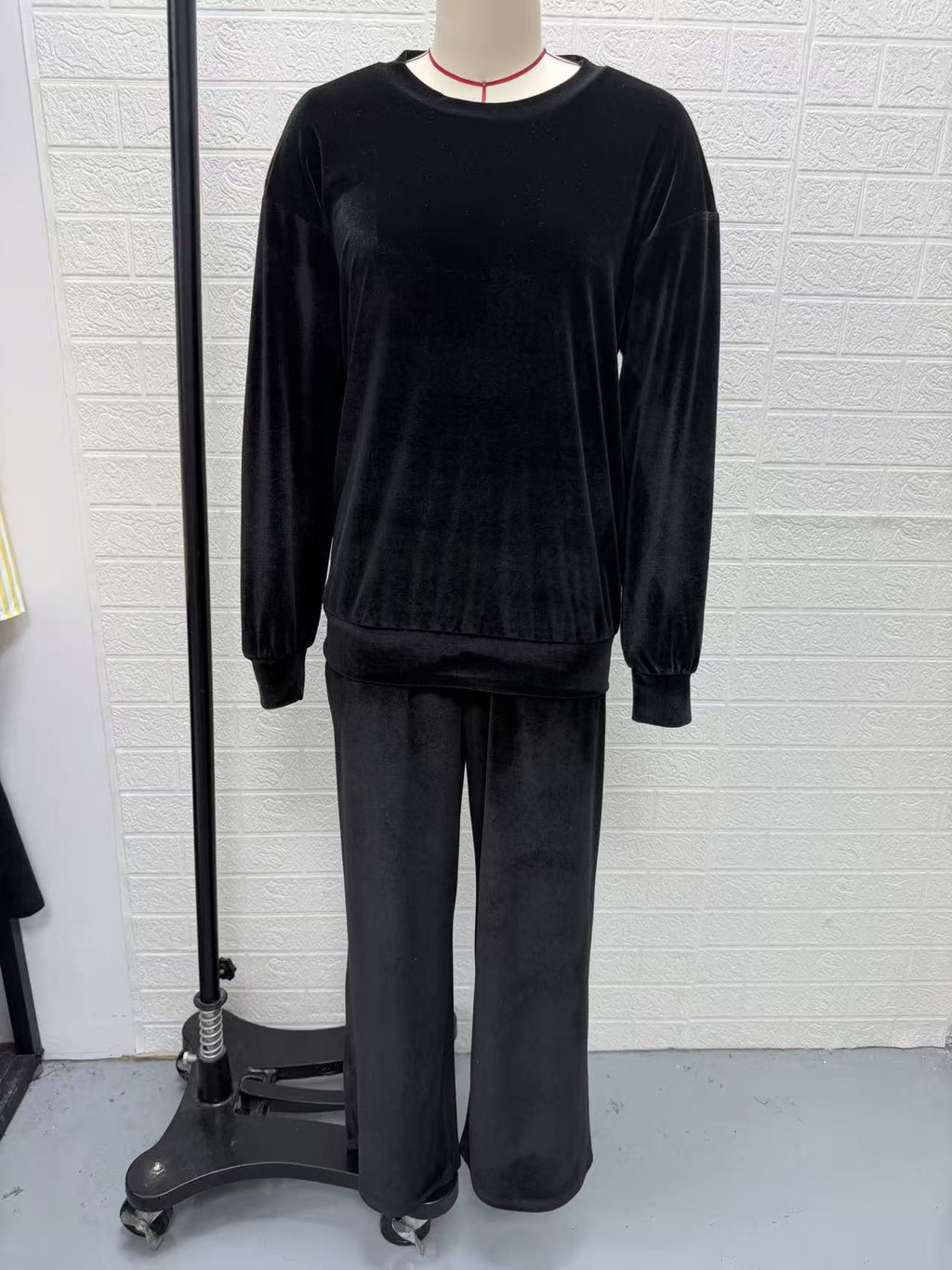 Velvet Pullover & Wide-Leg Pants Set in Black — front view on a dress form