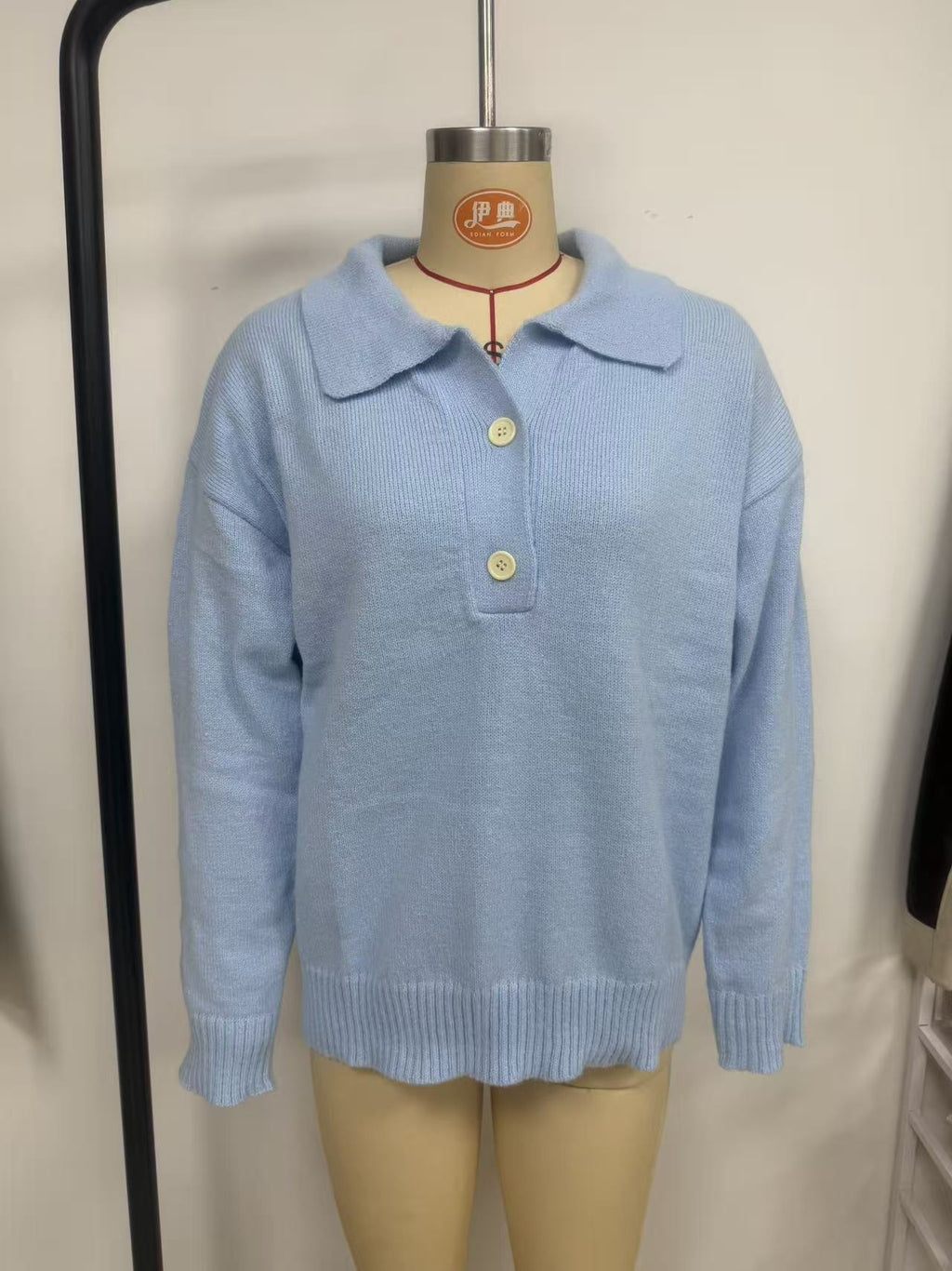 Polo-Collar Half-Button Knit Sweater in Light Blue — front view on a dress form