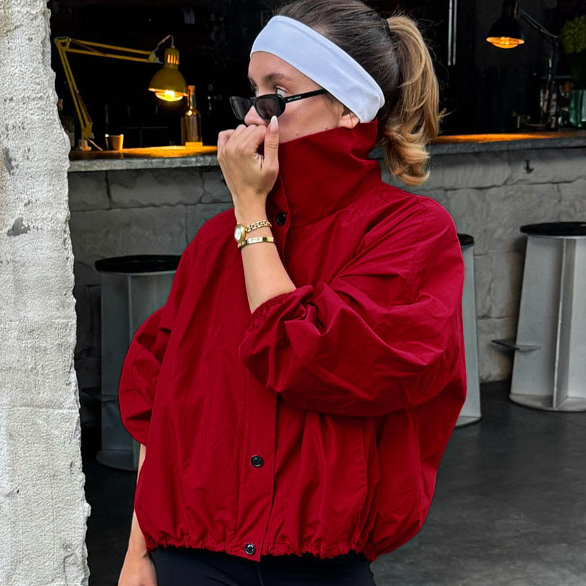 Button-Placket Stand-Collar Jacket with Elastic Cuffs in Red — front view on model with the collar up