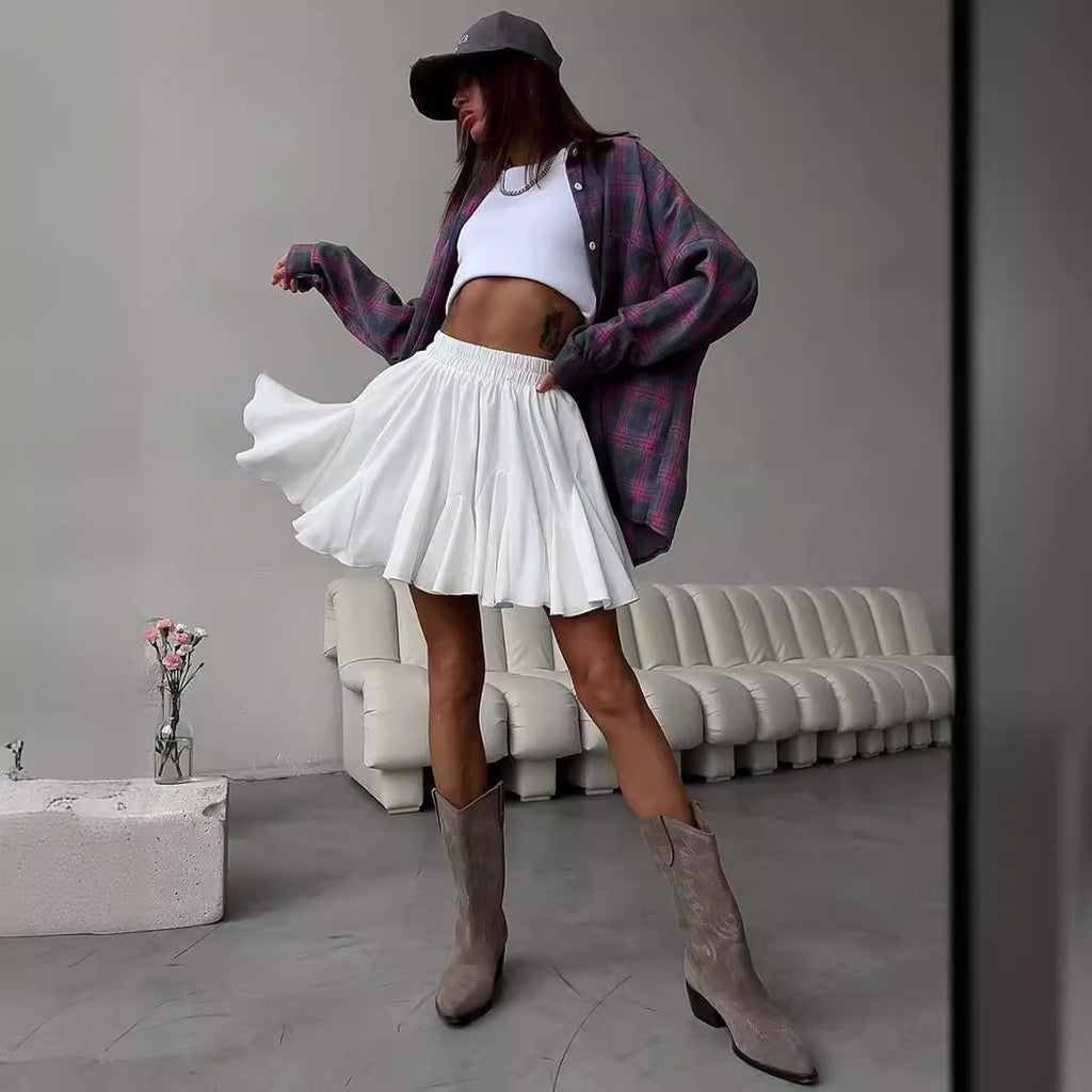 Pleated Bubble Mini Skirt in White — front view on model