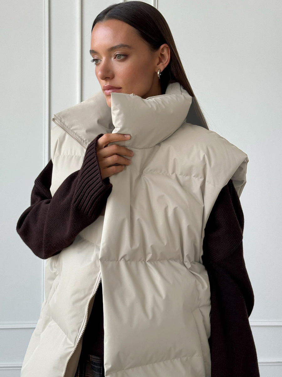 Longline Puffer Vest with High Stand Collar in Cream — front view on model