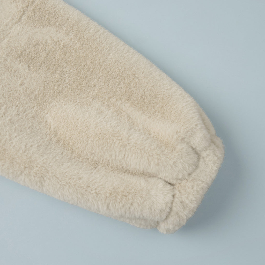 Plush Faux Fur Zip-Up Jacket with Stand Collar in Cream — close-up of the gathered cuff