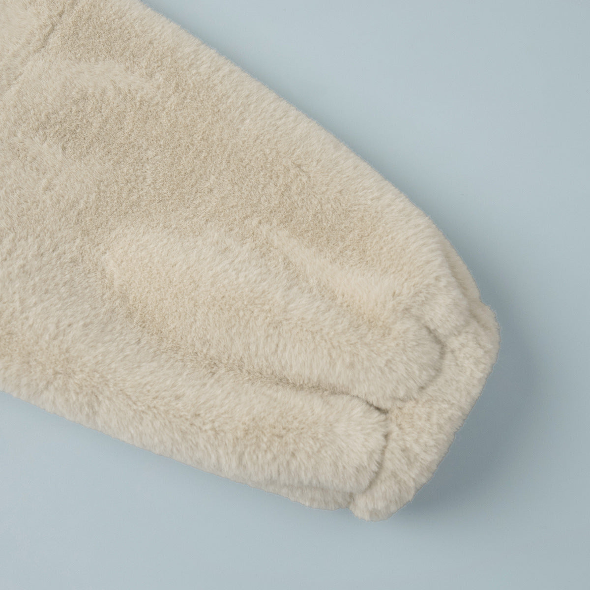Plush Faux Fur Zip-Up Jacket with Stand Collar in Cream — close-up of the gathered cuff
