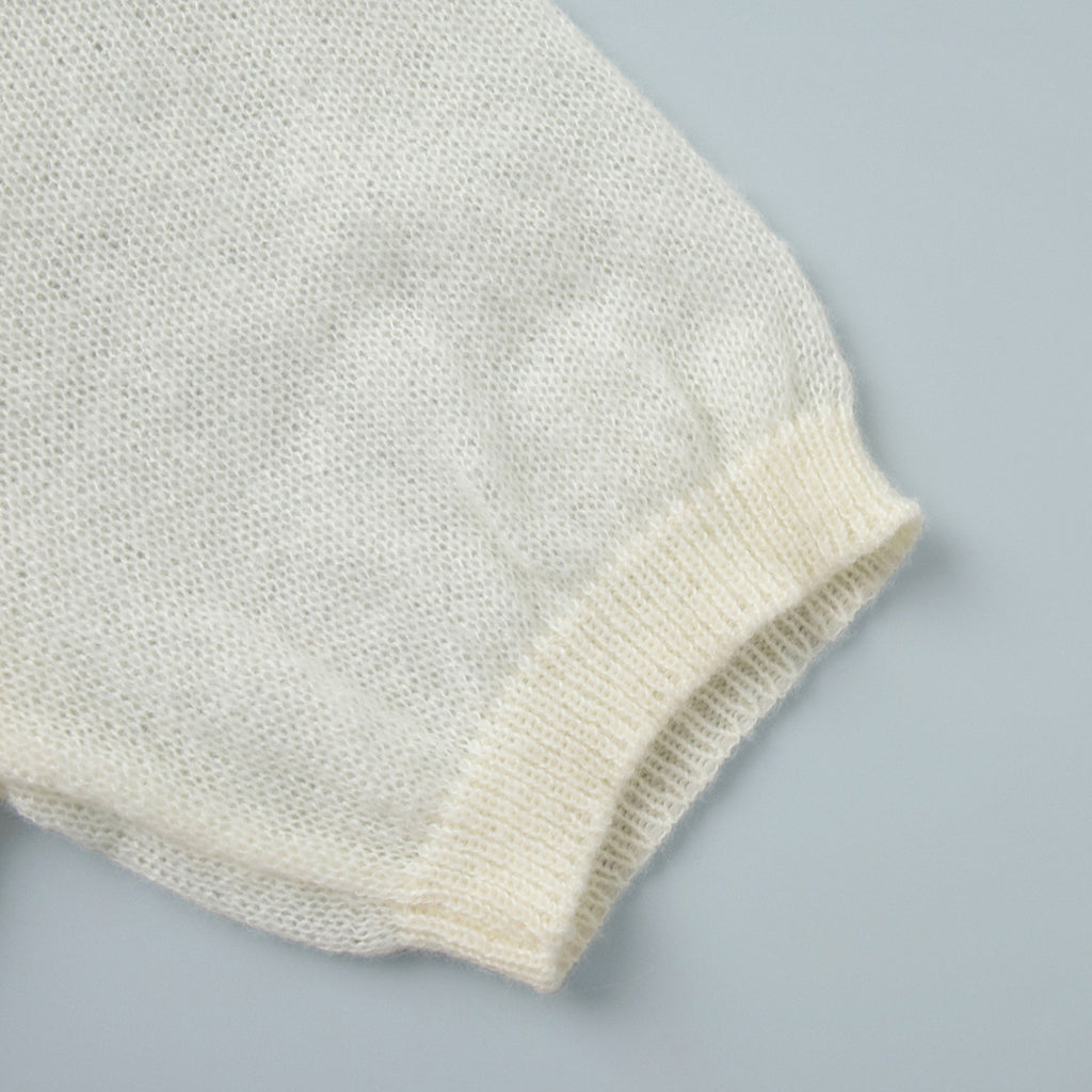 Soft Knit Short Sleeve Polo Top in Cream — close-up of the ribbed cuff