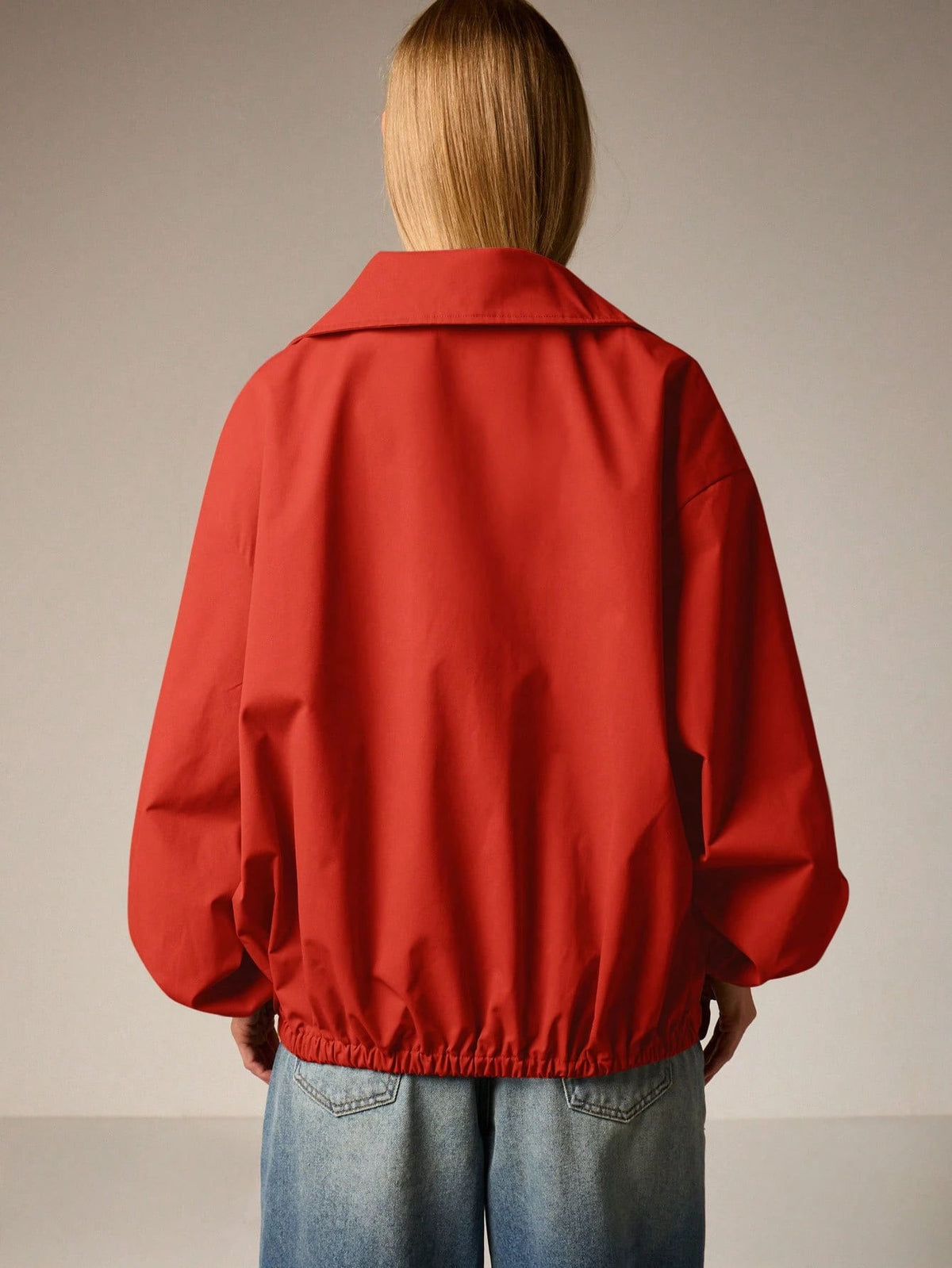 Oversized Half-Zip Funnel-Neck Windbreaker Jacket in Red — back view on model